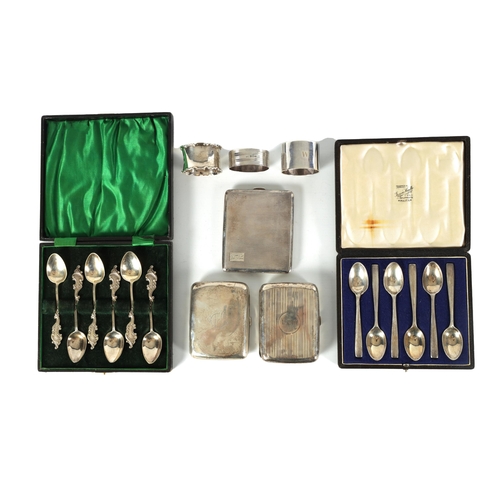 345 - TWO BOXED COLLECTIONS OF SIX SILVER TEASPOONS, THREE SILVER CIGARETTE CASES AND THREE SILVER NAPKIN ... 