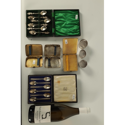 345 - TWO BOXED COLLECTIONS OF SIX SILVER TEASPOONS, THREE SILVER CIGARETTE CASES AND THREE SILVER NAPKIN ... 