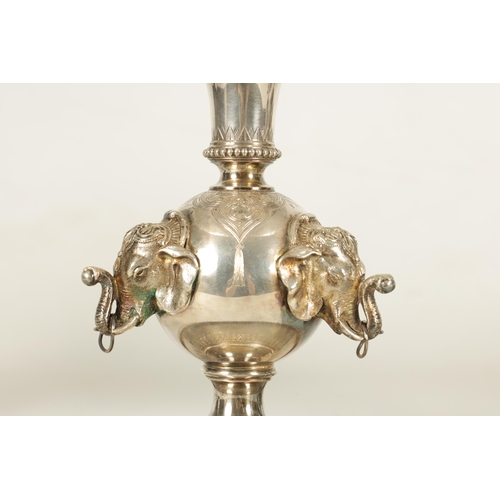 349 - A 19TH CENTURY SILVER PLATED THREE PIECE GARNITURE EPERGNE the tall centrepiece with etched glass to... 