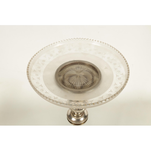 349 - A 19TH CENTURY SILVER PLATED THREE PIECE GARNITURE EPERGNE the tall centrepiece with etched glass to... 