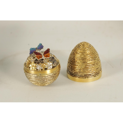 352 - A 1991 STUART DEVLIN SILVER GILT NOVELTY EGG the textured body with a plain girdle opening to reveal... 