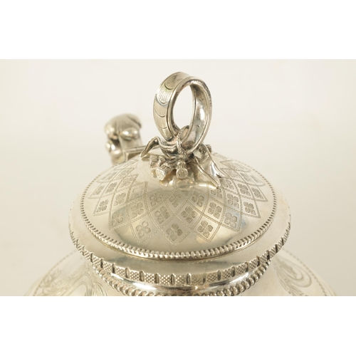 353 - A 19TH CENTURY CONTINENTAL SILVER THREE PIECE TEA SERVICE the engraved domed lids with ribbon and ta... 