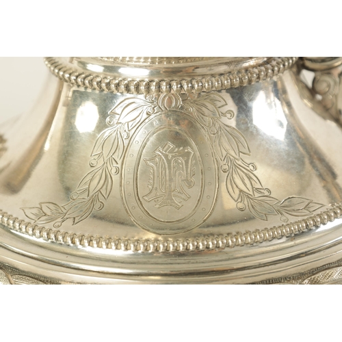 353 - A 19TH CENTURY CONTINENTAL SILVER THREE PIECE TEA SERVICE the engraved domed lids with ribbon and ta... 