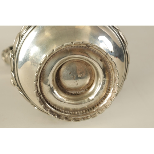 353 - A 19TH CENTURY CONTINENTAL SILVER THREE PIECE TEA SERVICE the engraved domed lids with ribbon and ta... 