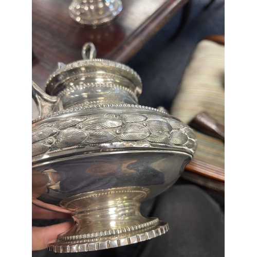 353 - A 19TH CENTURY CONTINENTAL SILVER THREE PIECE TEA SERVICE the engraved domed lids with ribbon and ta... 