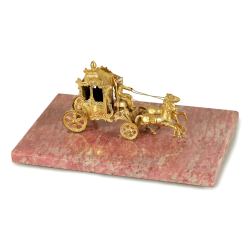 354 - A 19TH CENTURY FRENCH SILVER GILT MODEL OF A COACH AND HORSES WITH RIDER mounted on a veined pink ma... 