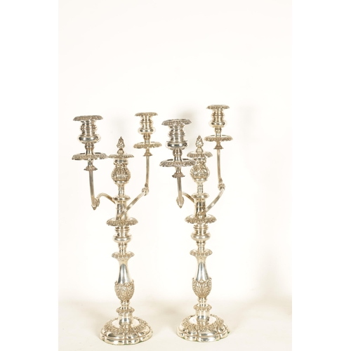 357 - A LARGE PAIR OF GEORGE IV SHEFFIELD PLATE TWO BRANCH CANDELABRA decorated with acanthus leaves and f... 