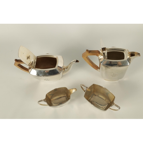 360 - A GEORGE VI ART DECO STYLE FOUR PIECE SILVER TEA SERVICE of plain rectangular rounded footed form wi... 