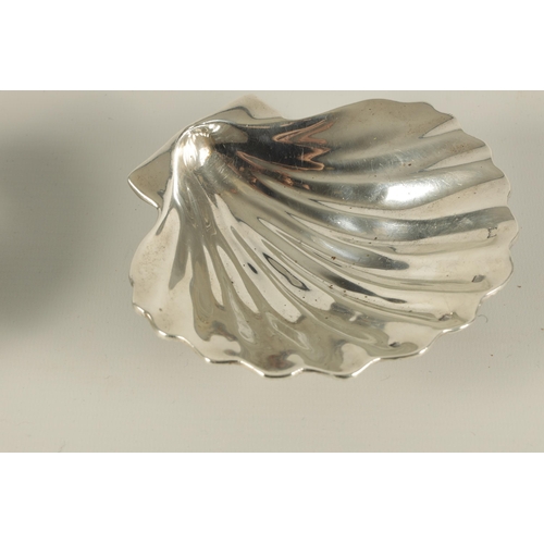 371 - A NEAR PAIR OF ELIZABETH II IRISH SILVER SCALLOP DISHES each with fluted bowl and naturalistic textu... 