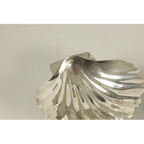 371 - A NEAR PAIR OF ELIZABETH II IRISH SILVER SCALLOP DISHES each with fluted bowl and naturalistic textu... 