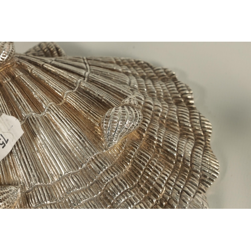 371 - A NEAR PAIR OF ELIZABETH II IRISH SILVER SCALLOP DISHES each with fluted bowl and naturalistic textu... 