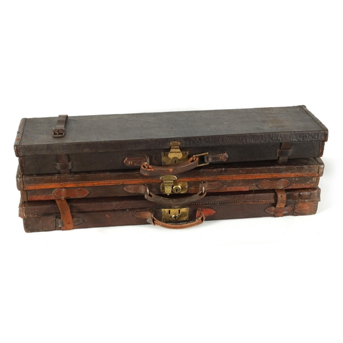 372 - A COLLECTION OF THREE LEATHER AND CANVAS LINED SHOTGUN CASES with brass locks and fitted interiors, ... 