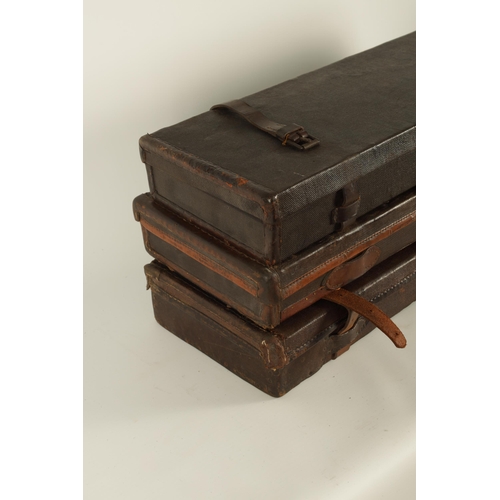 372 - A COLLECTION OF THREE LEATHER AND CANVAS LINED SHOTGUN CASES with brass locks and fitted interiors, ... 