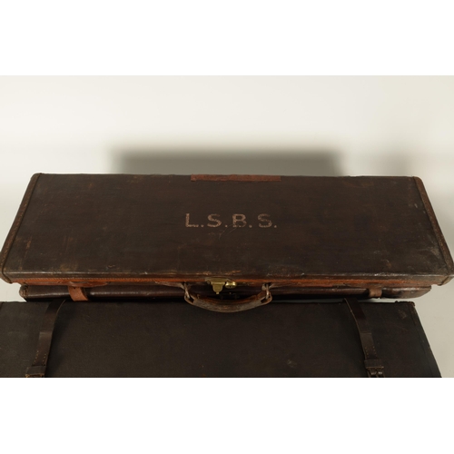 372 - A COLLECTION OF THREE LEATHER AND CANVAS LINED SHOTGUN CASES with brass locks and fitted interiors, ... 