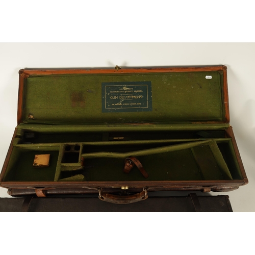 372 - A COLLECTION OF THREE LEATHER AND CANVAS LINED SHOTGUN CASES with brass locks and fitted interiors, ... 