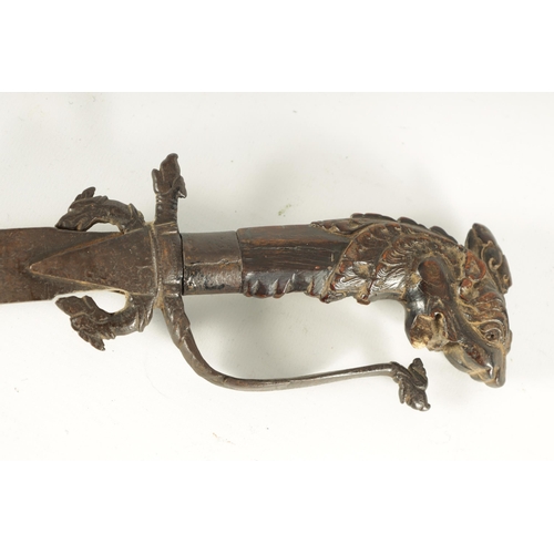 378 - AN 18TH CENTURY SRI LANKAN RHINOCEROS HORN HANDLED KASTANE SWORD the handle formed as a dragon with ... 