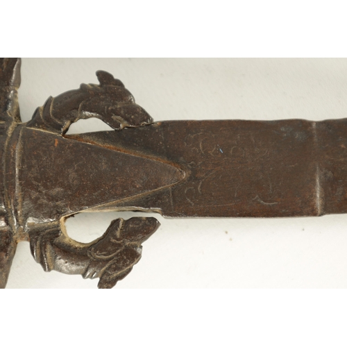 378 - AN 18TH CENTURY SRI LANKAN RHINOCEROS HORN HANDLED KASTANE SWORD the handle formed as a dragon with ... 