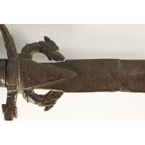 378 - AN 18TH CENTURY SRI LANKAN RHINOCEROS HORN HANDLED KASTANE SWORD the handle formed as a dragon with ... 