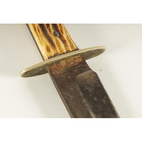 379 - A LATE 19TH CENTURY STAG HORN HANDLED BOWIE KNIFE with nickel guard and single edged steel blade wit... 