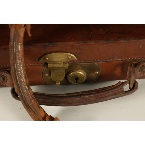 388 - A LEATHER BOUND SHOTGUN CASE BY THOMAS BLAND & SONS LONDON with fitted interior, original label and ... 