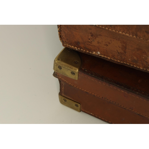 388 - A LEATHER BOUND SHOTGUN CASE BY THOMAS BLAND & SONS LONDON with fitted interior, original label and ... 