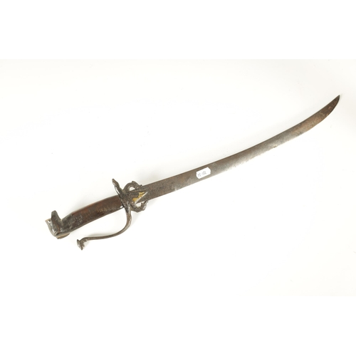 394 - AN 18TH CENTURY SRI LANKAN RHINOCEROS HORN HANDLED KASTANE SWORD the handle formed as a primitively ... 