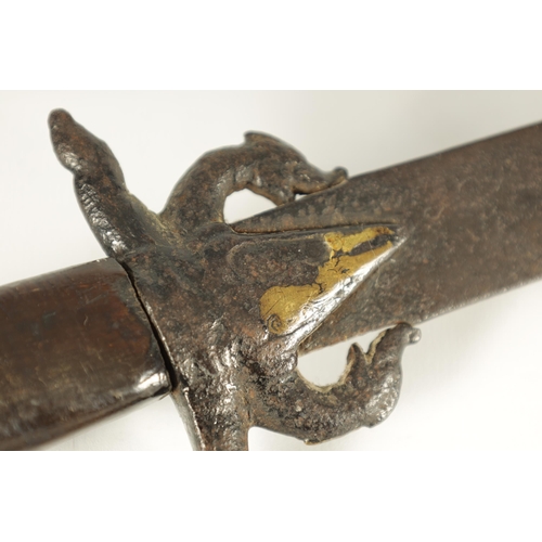 394 - AN 18TH CENTURY SRI LANKAN RHINOCEROS HORN HANDLED KASTANE SWORD the handle formed as a primitively ... 