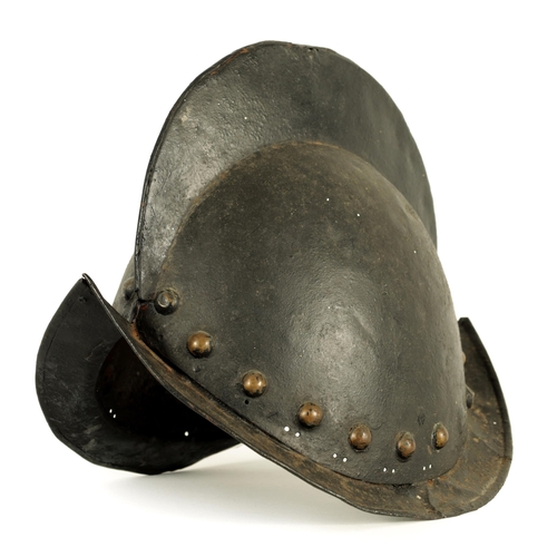 427 - A 19TH CENTURY SPANISH COMB MORION BOAT STLYE HELMET with shaped rim and riveted edge. (31cm wide 22... 