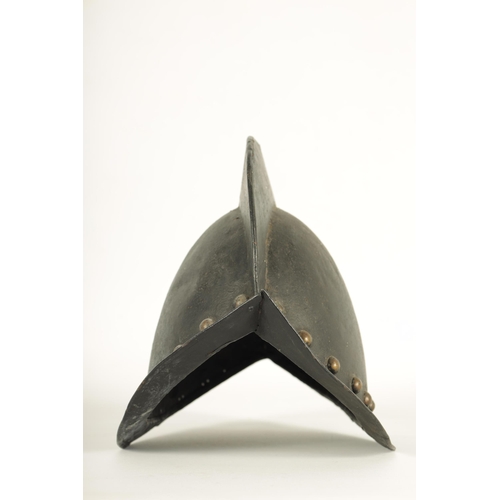 427 - A 19TH CENTURY SPANISH COMB MORION BOAT STLYE HELMET with shaped rim and riveted edge. (31cm wide 22... 