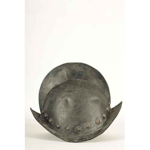 427 - A 19TH CENTURY SPANISH COMB MORION BOAT STLYE HELMET with shaped rim and riveted edge. (31cm wide 22... 