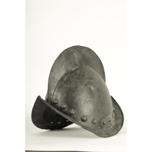 427 - A 19TH CENTURY SPANISH COMB MORION BOAT STLYE HELMET with shaped rim and riveted edge. (31cm wide 22... 