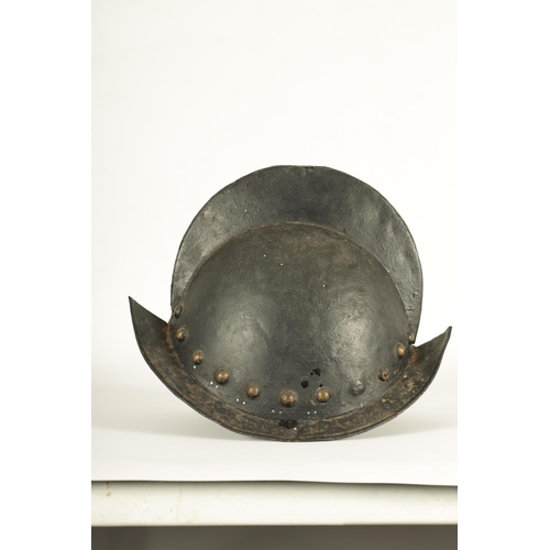 427 - A 19TH CENTURY SPANISH COMB MORION BOAT STLYE HELMET with shaped rim and riveted edge. (31cm wide 22... 