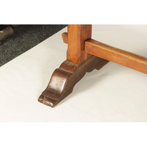 1197 - A 17TH CENTURY WALNUT TRESTLE TABLE the two piece top above square end supports with sledge feet joi... 