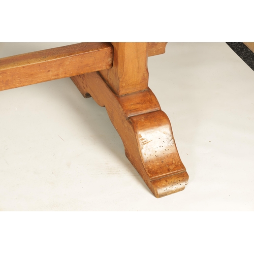 1197 - A 17TH CENTURY WALNUT TRESTLE TABLE the two piece top above square end supports with sledge feet joi... 