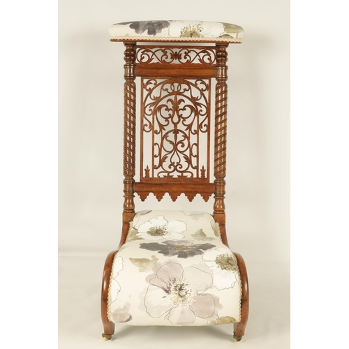 1202 - A 19TH CENTURY FIGURED ROSEWOOD PRAYER CHAIR with fret work back flanked by twisted columns and low ... 