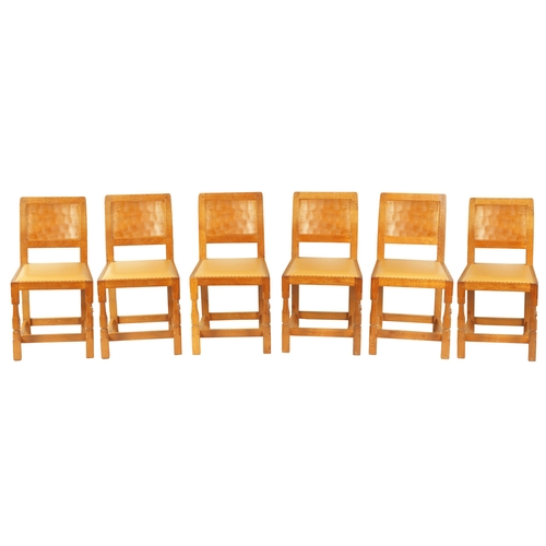 1203 - A SET OF SIX ROBERT 'MOUSEMAN' THOMPSON AZED OAK DINING CHAIRS with panel backs and hide leather sea... 