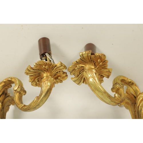 753 - A PAIR OF LATE 19TH CENTURY FRENCH GILT ORMOLU SINGLE BRANCH WALL SCONES in the scrolled leafwork ro... 