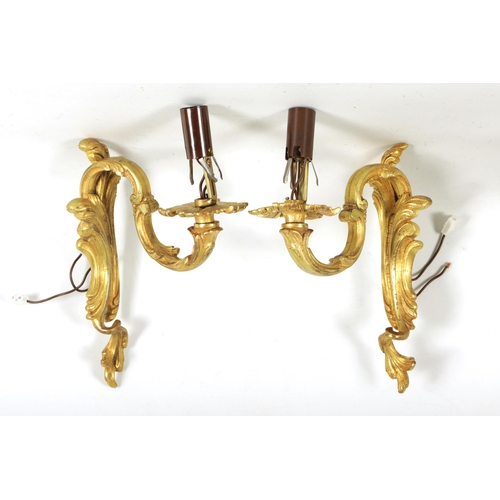 753 - A PAIR OF LATE 19TH CENTURY FRENCH GILT ORMOLU SINGLE BRANCH WALL SCONES in the scrolled leafwork ro... 