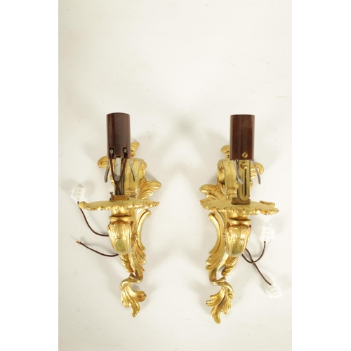 753 - A PAIR OF LATE 19TH CENTURY FRENCH GILT ORMOLU SINGLE BRANCH WALL SCONES in the scrolled leafwork ro... 