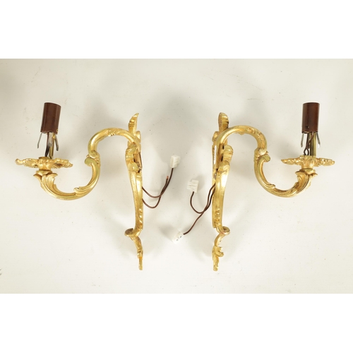 753 - A PAIR OF LATE 19TH CENTURY FRENCH GILT ORMOLU SINGLE BRANCH WALL SCONES in the scrolled leafwork ro... 