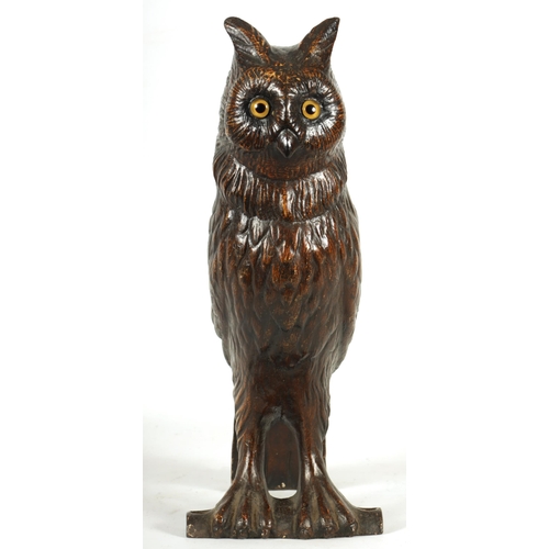 758 - A LATE 19TH CENTURY LIFE SIZE COLD PAINTED CAST IRON OWL with inset amber glass eyes perched on a ba... 