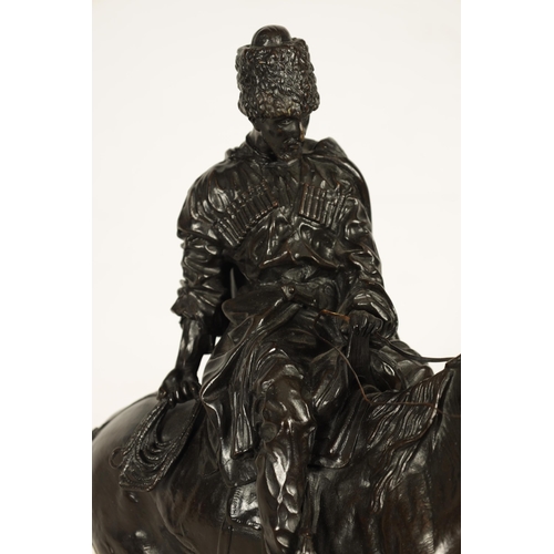 760 - E. NAHCEPE. A LATE 19TH CENTURY RUSSIAN PATINATED BRONZE SCULPTURE modelled as a Cossack on horsebac... 