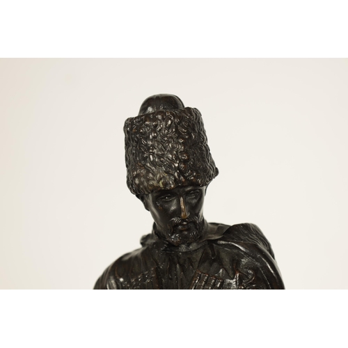 760 - E. NAHCEPE. A LATE 19TH CENTURY RUSSIAN PATINATED BRONZE SCULPTURE modelled as a Cossack on horsebac... 