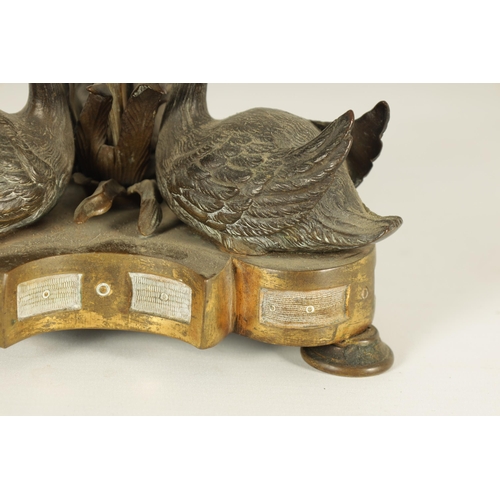 764 - A MID 19TH CENTURY PATINATED BRONZE AND ORMOLU SWAN CENTREPIECE after a design by William Bateman II... 