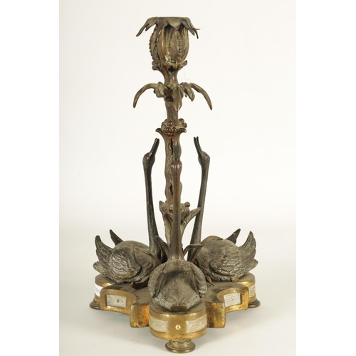 764 - A MID 19TH CENTURY PATINATED BRONZE AND ORMOLU SWAN CENTREPIECE after a design by William Bateman II... 