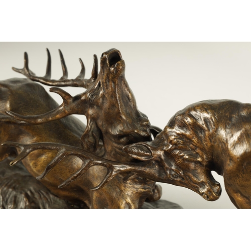 768 - THOMAS FRANCO CARTIER (1879-1943) A LARGE 19TH CENTURY FRENCH BRONZE SCULPTURE modelled as two stags... 