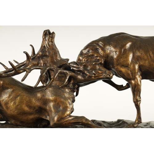 768 - THOMAS FRANCO CARTIER (1879-1943) A LARGE 19TH CENTURY FRENCH BRONZE SCULPTURE modelled as two stags... 