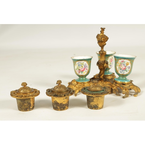 769 - A 18TH CENTURY FRENCH ROCOCO ORMOLU AND SERVES STYLE TRIPLE INKSTAND or ornate scrolled leaf cast de... 