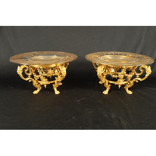 775 - FERDINAND BARBEDIENNE. AN UNUSUAL SET OF EIGHT19TH CENTURY ORMOLU TABLE COMPORTS with gilt edged gla... 