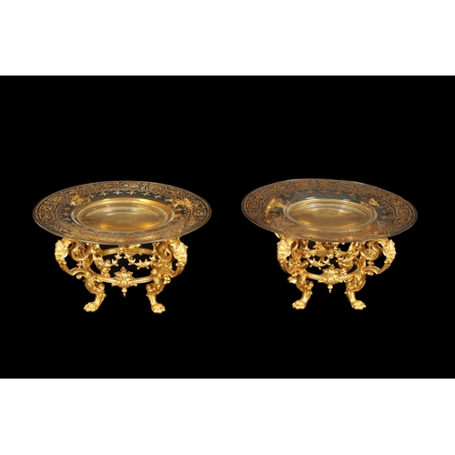 775 - FERDINAND BARBEDIENNE. AN UNUSUAL SET OF EIGHT19TH CENTURY ORMOLU TABLE COMPORTS with gilt edged gla... 